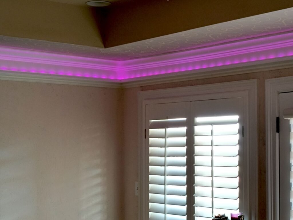 Indirect Lighting, example of pinkish LED light strips installed in a room