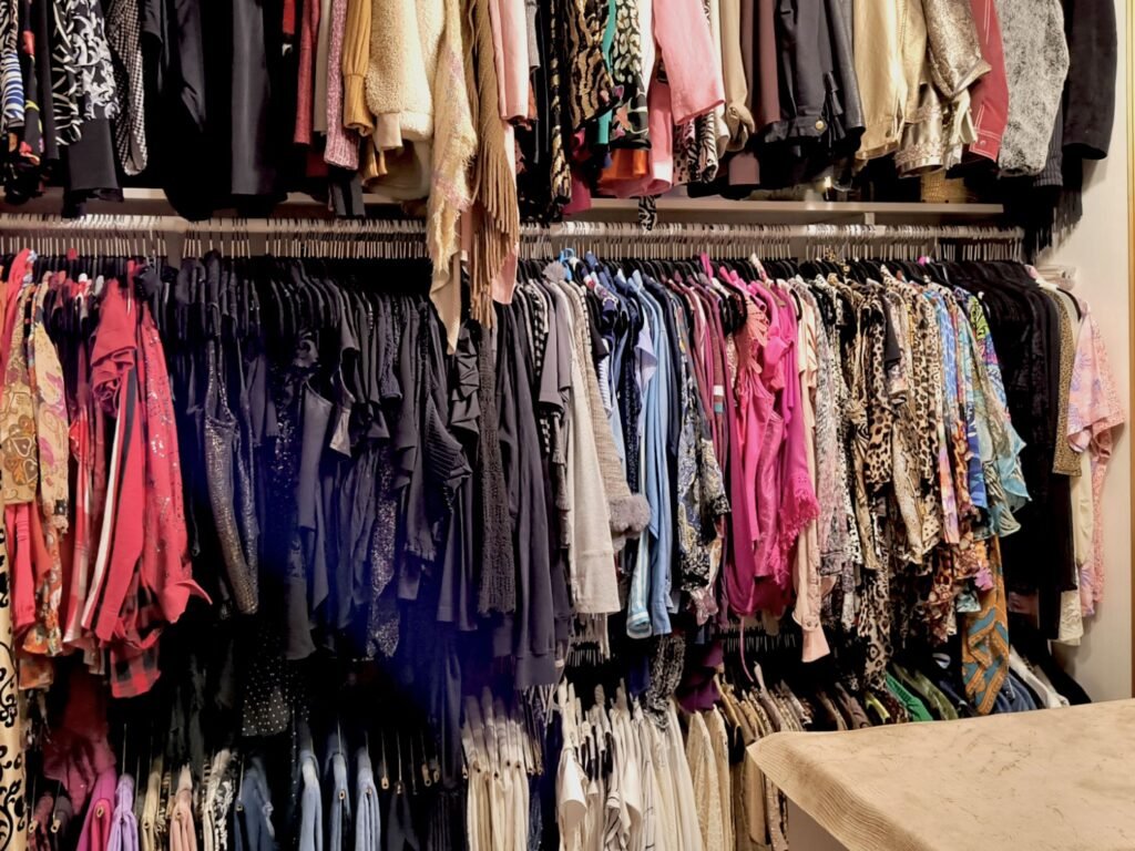 How to convert a spare bedroom into a closet, view of filled clothing racks