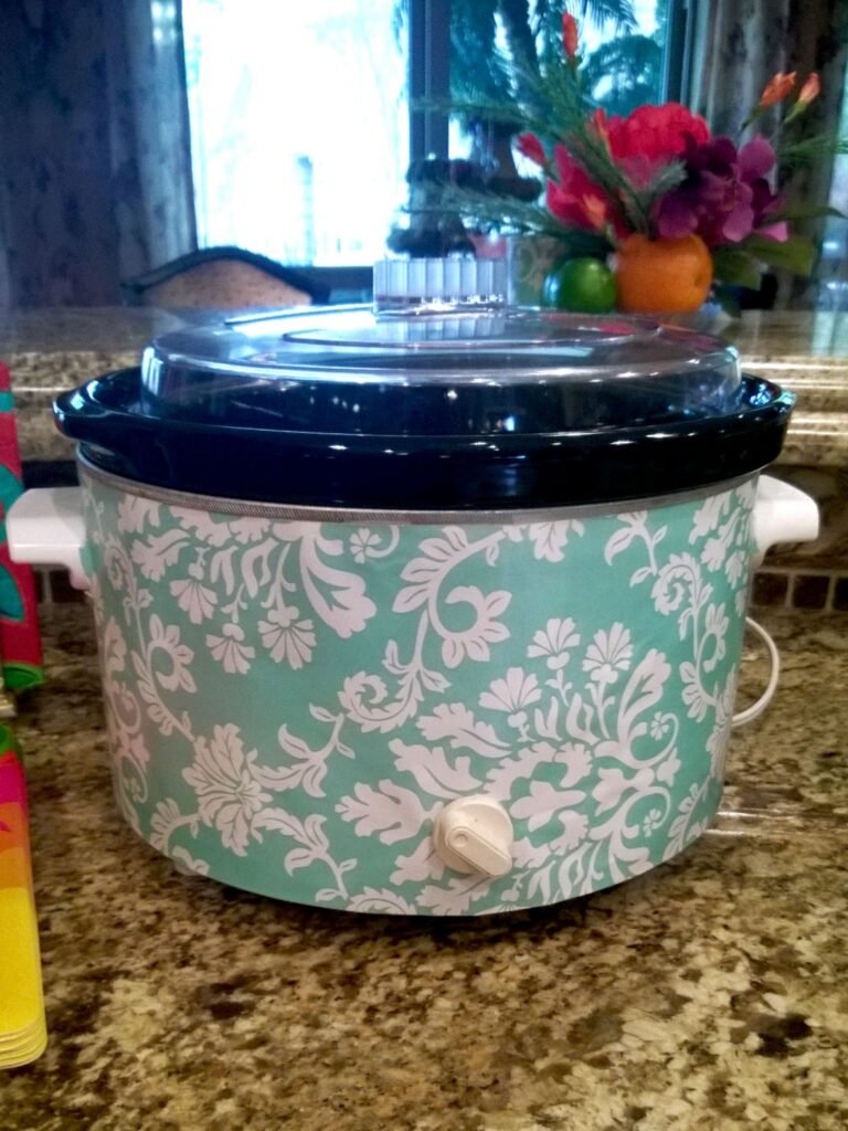 Kitchen DIY decor, example of making a slow cooker match the party theme with a paper cover