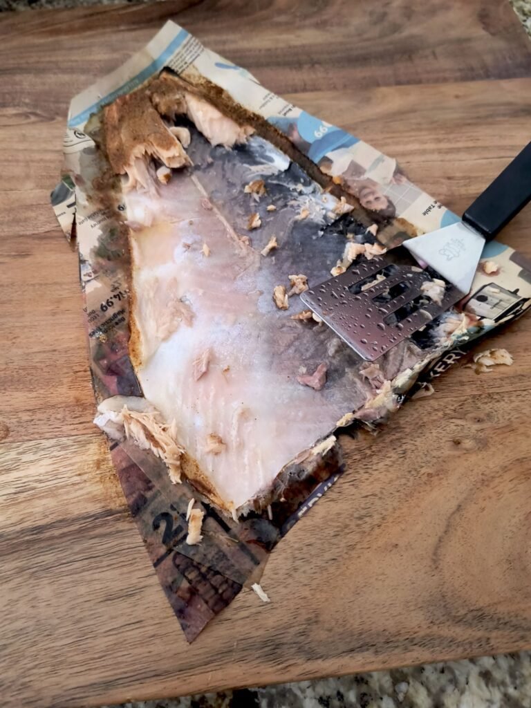 Salmon skin sticks to newspaper when grilled with indirect heat