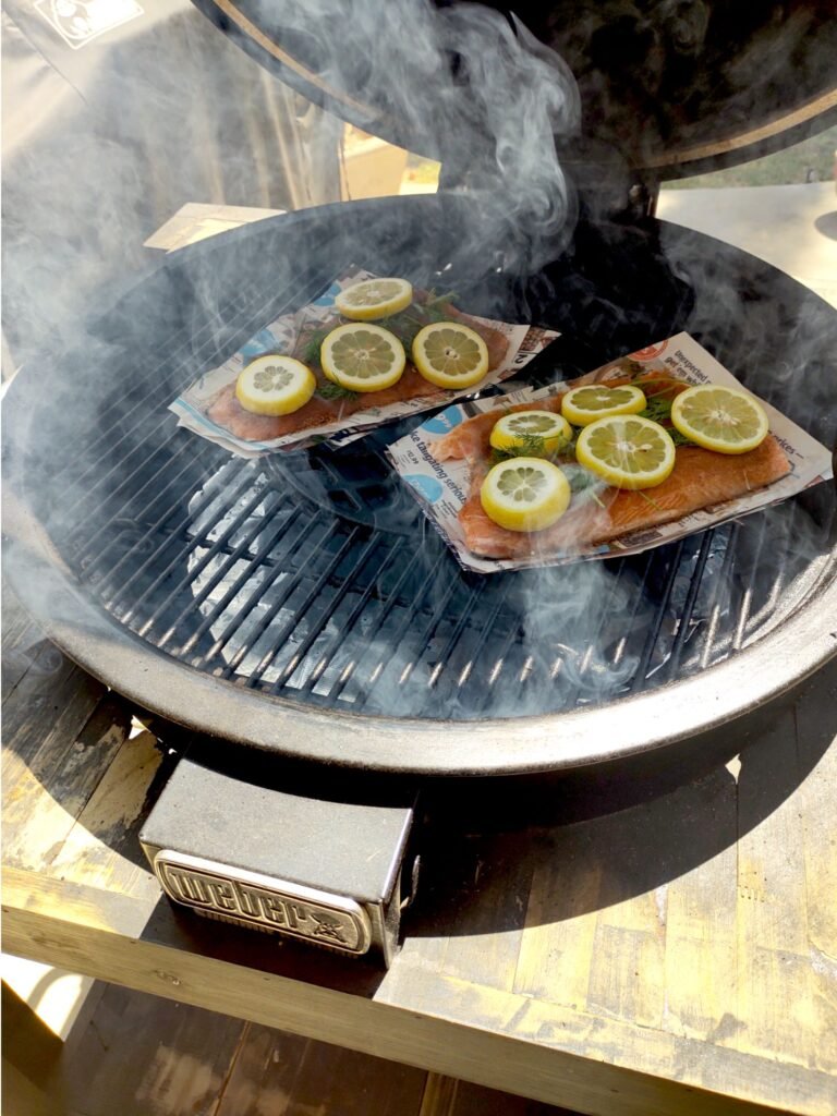 Easy dinner party food: Salmon on newspaper with indirect heat on the Weber Summit Kamado Grill