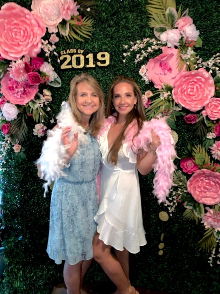 how to make a photo backdrop, the finished screen with guest of honor and her mom