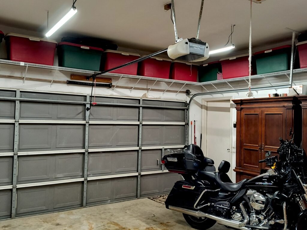 Save money on garage organization with wire shelving and totes up high out of the way