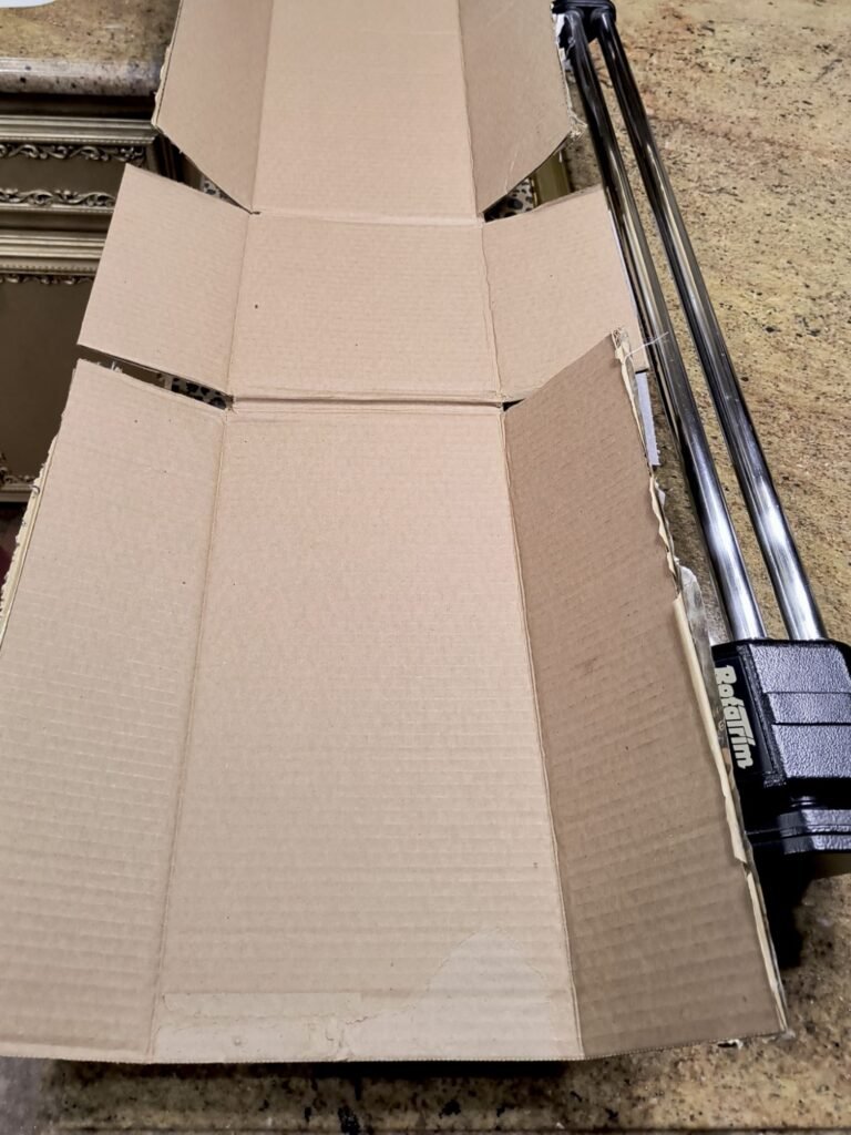 Cardboard box that has been opened and laid flat