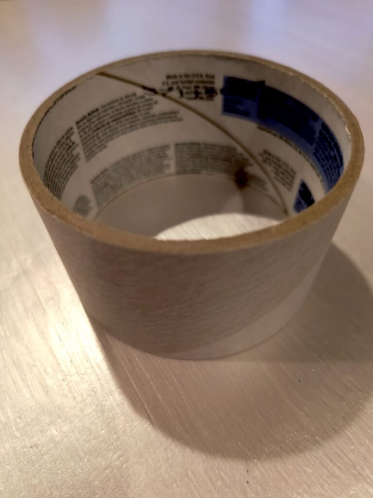 The inner cardboard core from a roll of packing tape