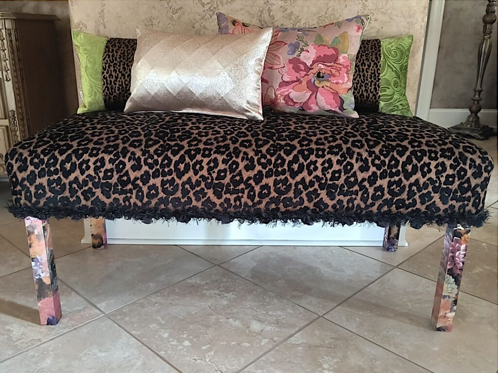 Cheetah fabric covered bench with updated legs using metallic foil