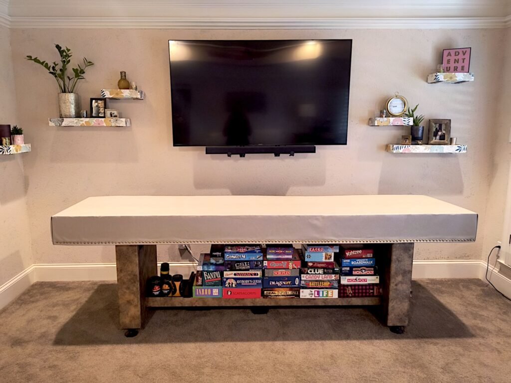 Neutral-themed game room featuring shuffeboard