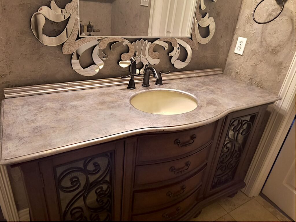 Large bathroom vanity after updates with metallic foil